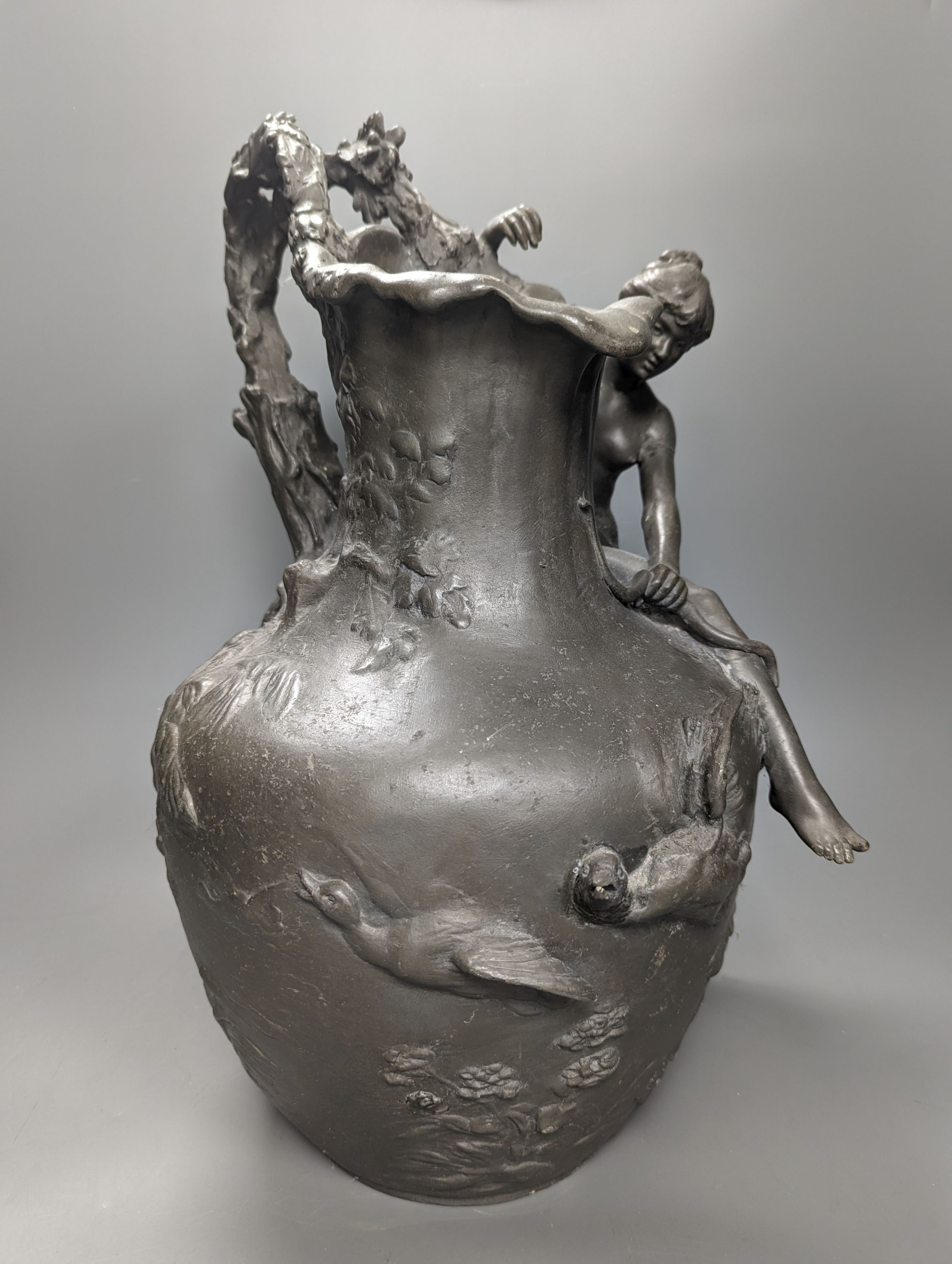 A heavy cast pewter figural ewer, in Art Nouveau style, based on a model by A. Vibert, unsigned, height 45cm